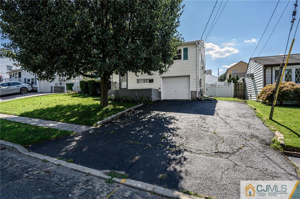 7 Florence Drive Sayreville, NJ 08859 - Photo 42 of 42 a front view of a house with a yard and a garage