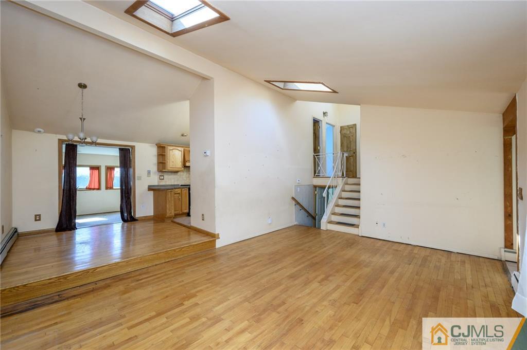 7 Florence Drive Sayreville, NJ 08859 - Photo 6 of 42 wooden floor in an empty room with a window