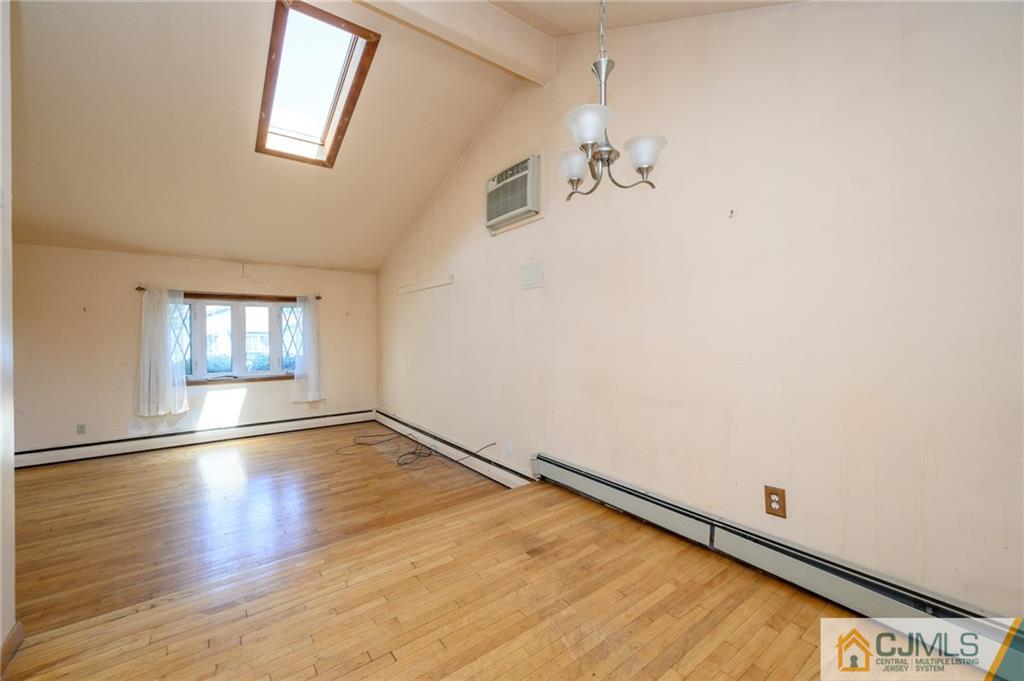 7 Florence Drive Sayreville, NJ 08859 - Photo 10 of 42 an empty room with wooden floor and windows