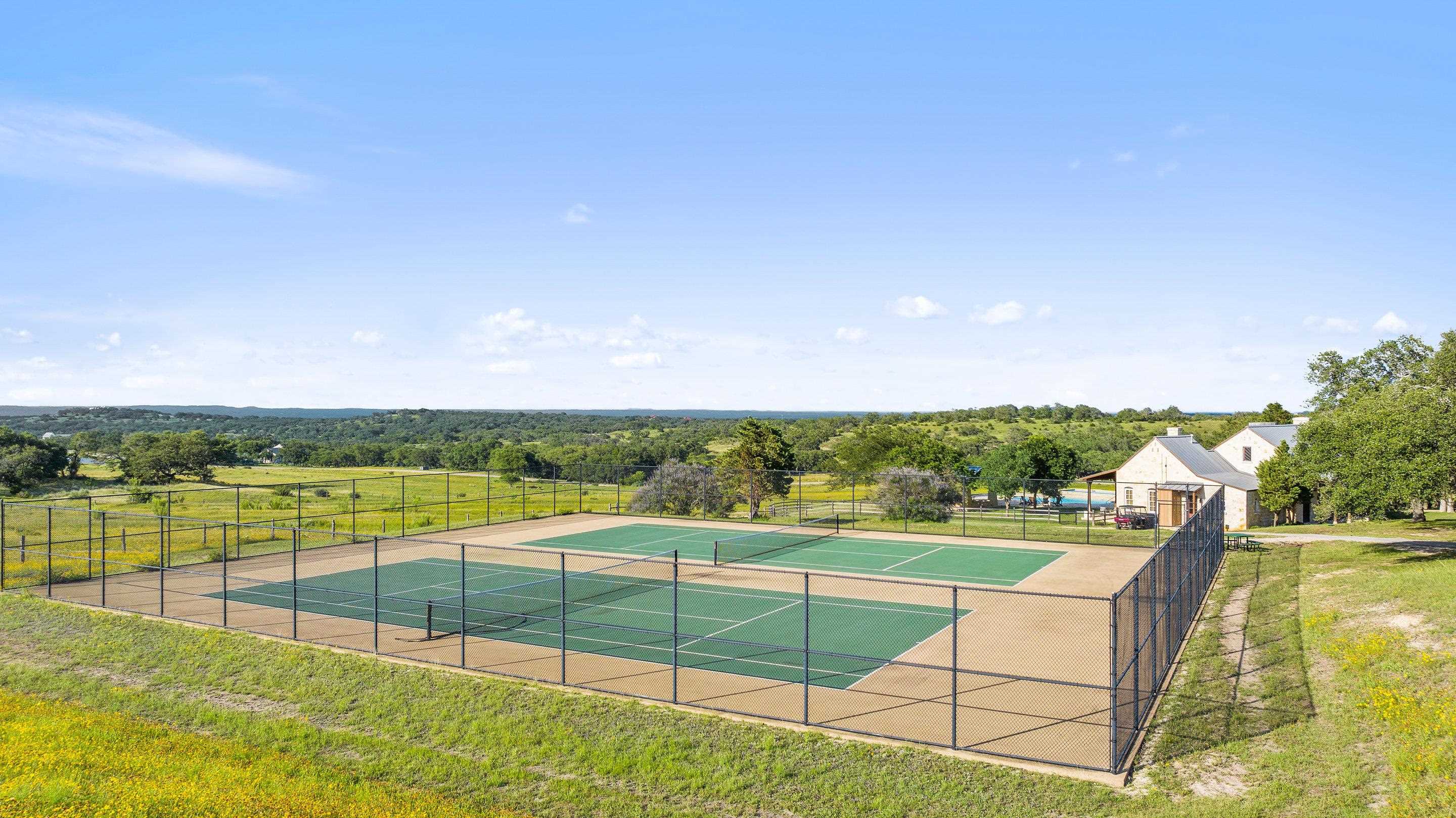 613 Cattle Creek Road Johnson City, TX 78636 - Photo 12 of 18 a view of a swimming pool with a lake view