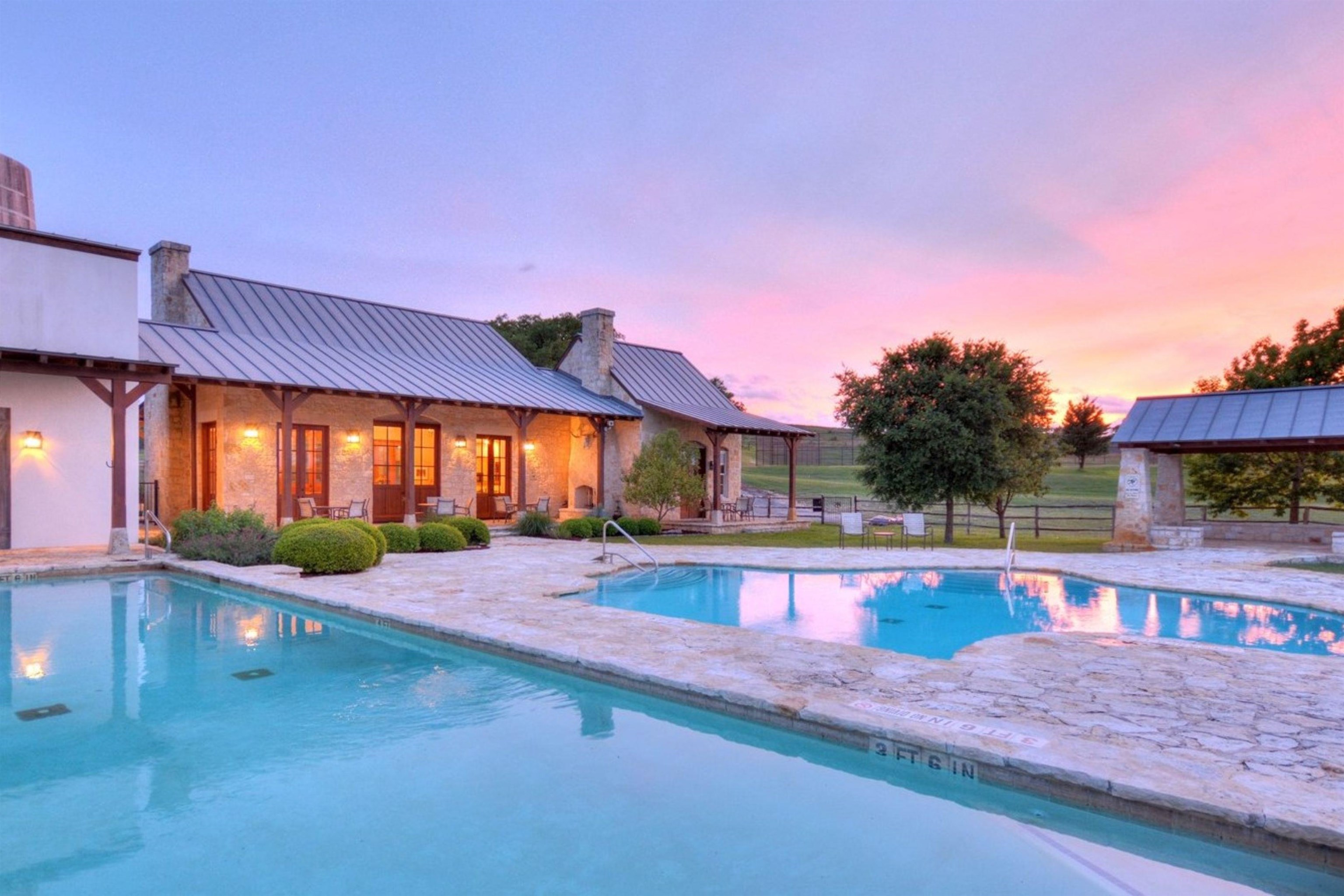 613 Cattle Creek Road Johnson City, TX 78636 - Photo 16 of 18 a view of a house with swimming pool and sitting area