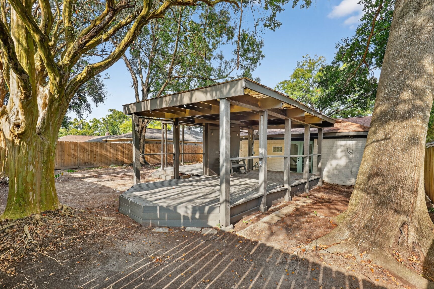16122 Rill Lane Houston, TX 77062 - Photo 20 of 23 a view of a house with backyard porch and sitting area
