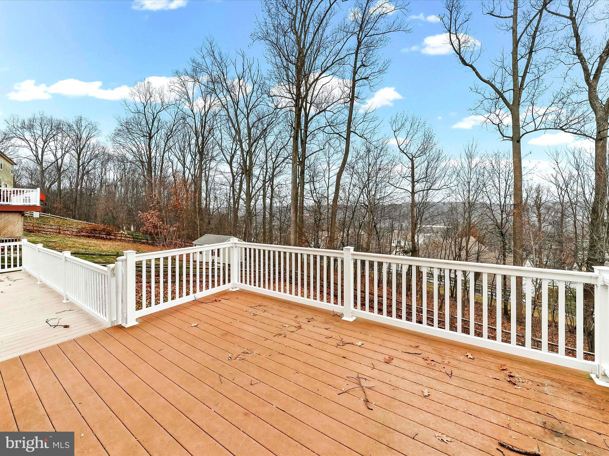3033 Honeymead Road Downingtown, PA 19335 - Photo 11 of 47 a balcony with wooden floor and fence