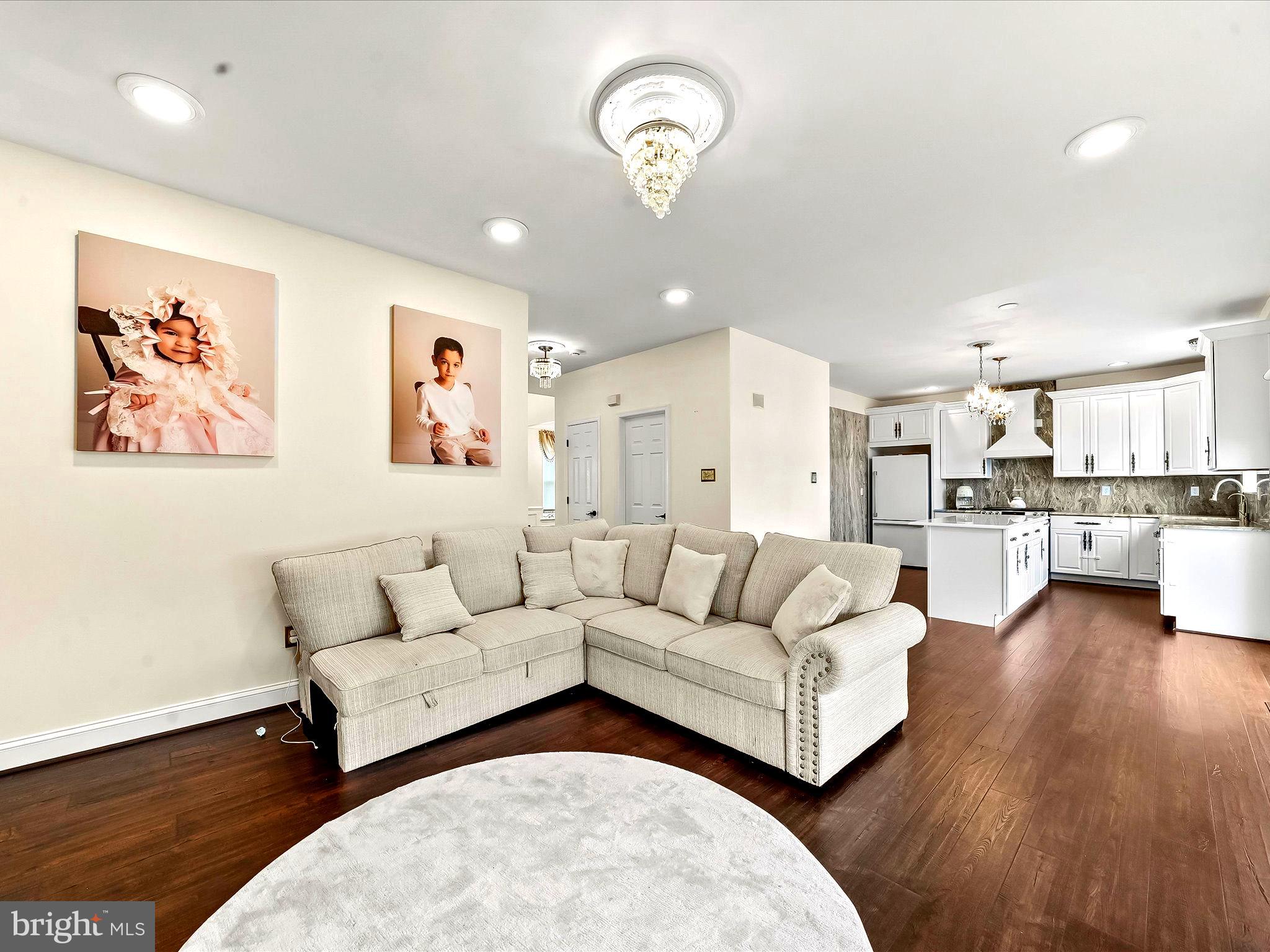 3033 Honeymead Road Downingtown, PA 19335 - Photo 20 of 47 a living room with furniture and kitchen view