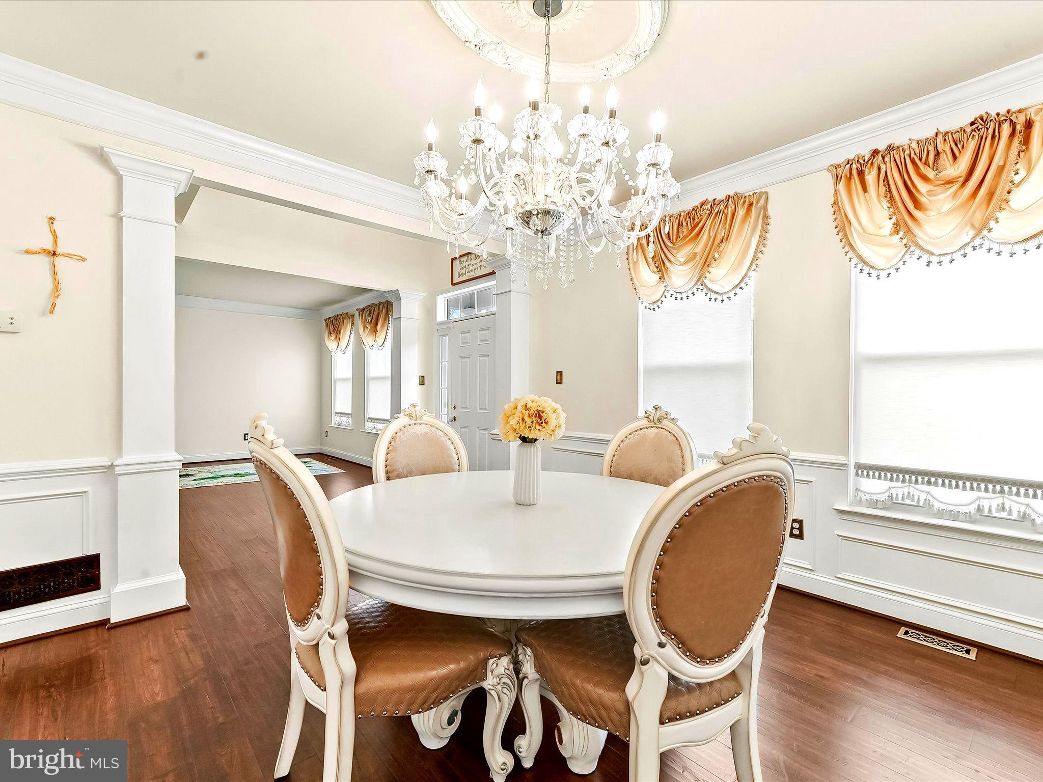 3033 Honeymead Road Downingtown, PA 19335 - Photo 23 of 47 a view of a dining room with furniture a chandelier and wooden floor