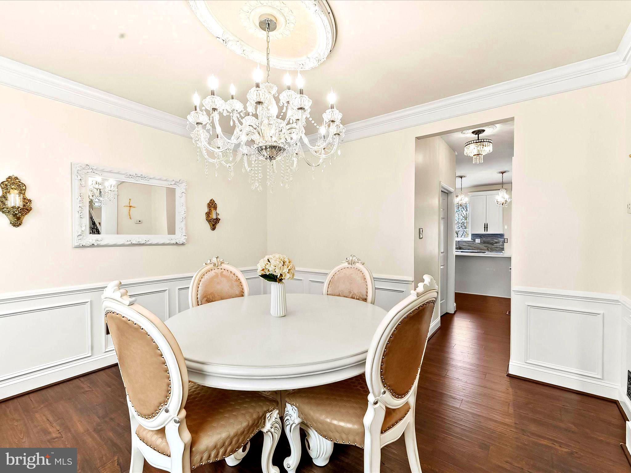 3033 Honeymead Road Downingtown, PA 19335 - Photo 24 of 47 a view of a dining room with furniture wooden floor and chandelier