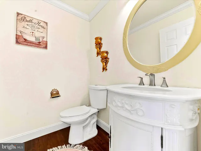 a bathroom with a sink a mirror and a toilet