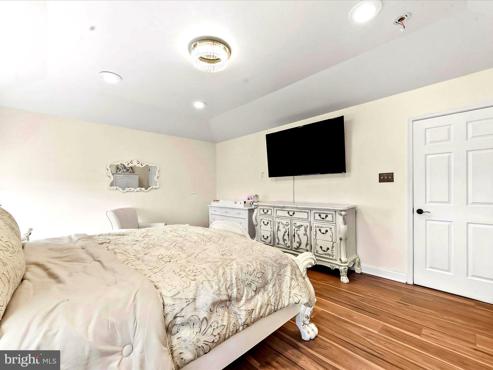 3033 Honeymead Road Downingtown, PA 19335 - Photo 31 of 47 a bedroom with a bed and a flat screen tv