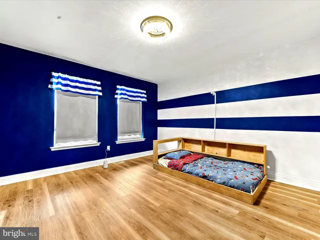 a bed room with a bed and a window