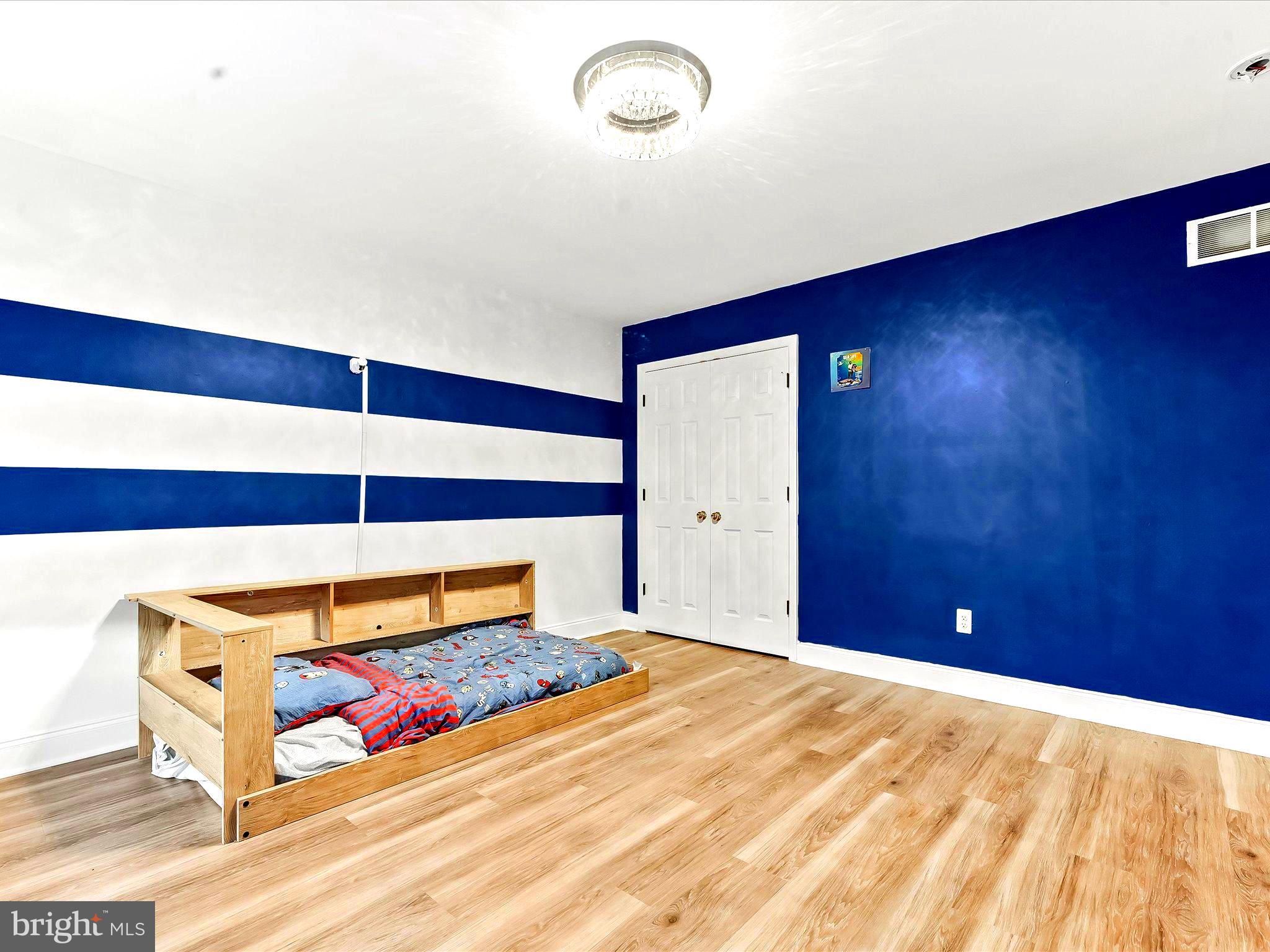 3033 Honeymead Road Downingtown, PA 19335 - Photo 39 of 47 a bedroom with a bed and a lamp on table