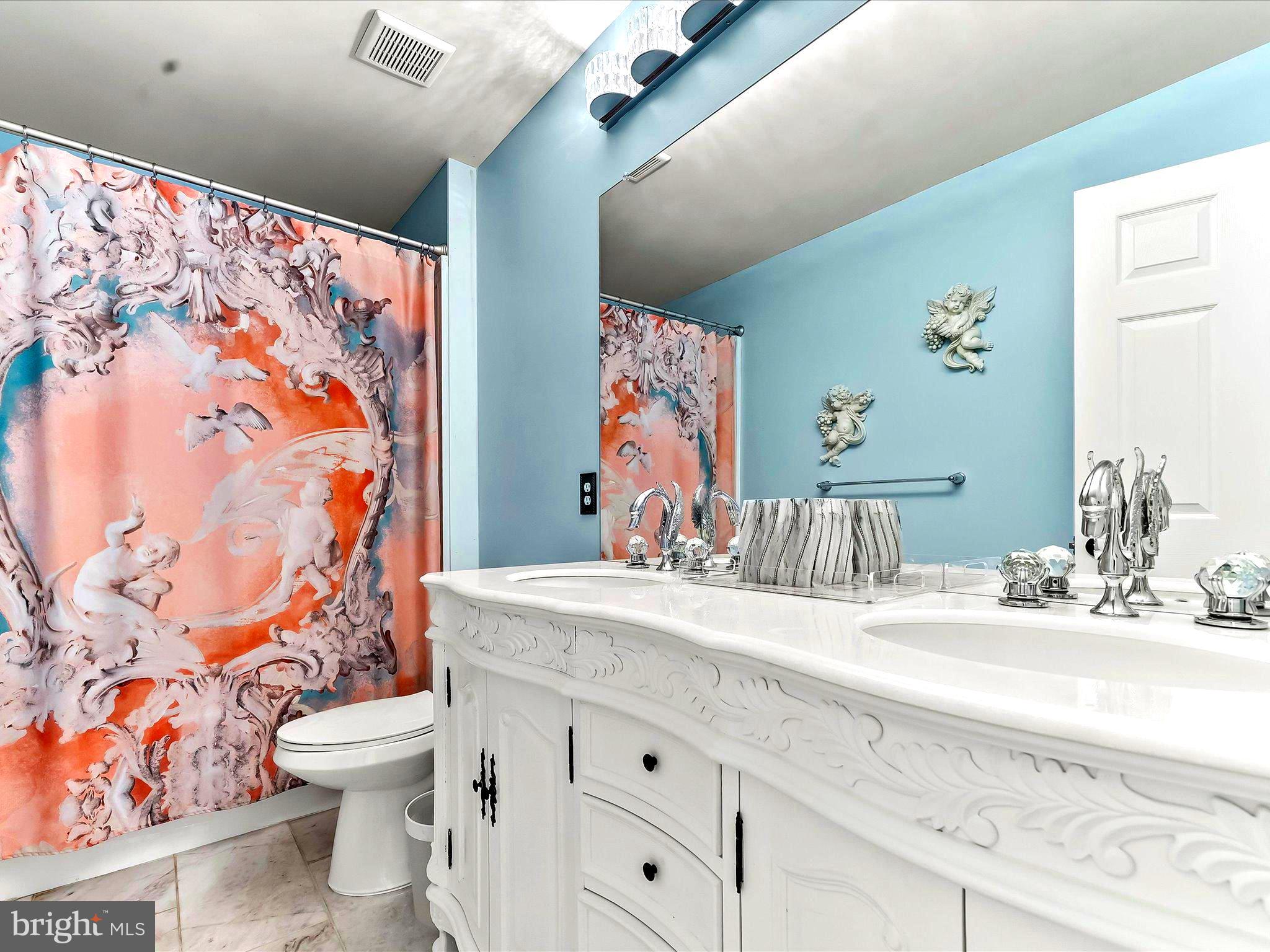 3033 Honeymead Road Downingtown, PA 19335 - Photo 40 of 47 a bathroom with a sink a toilet and a mirror