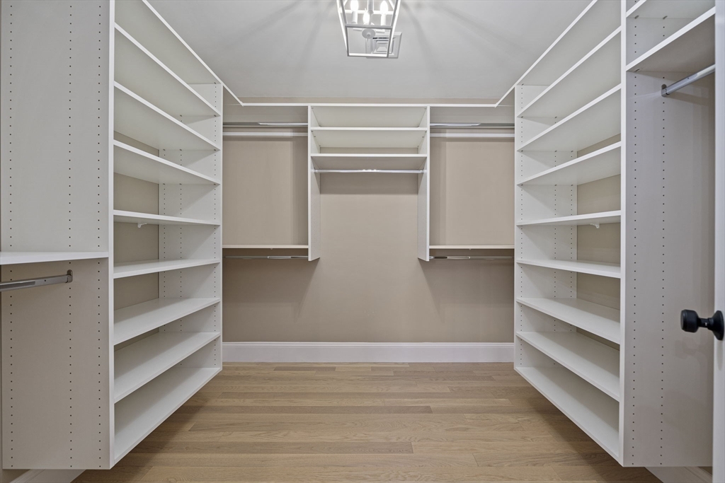 45 Red Gold Farm Road Marshfield, MA 02050 - Photo 19 of 40 a view of walk in closet with empty racks