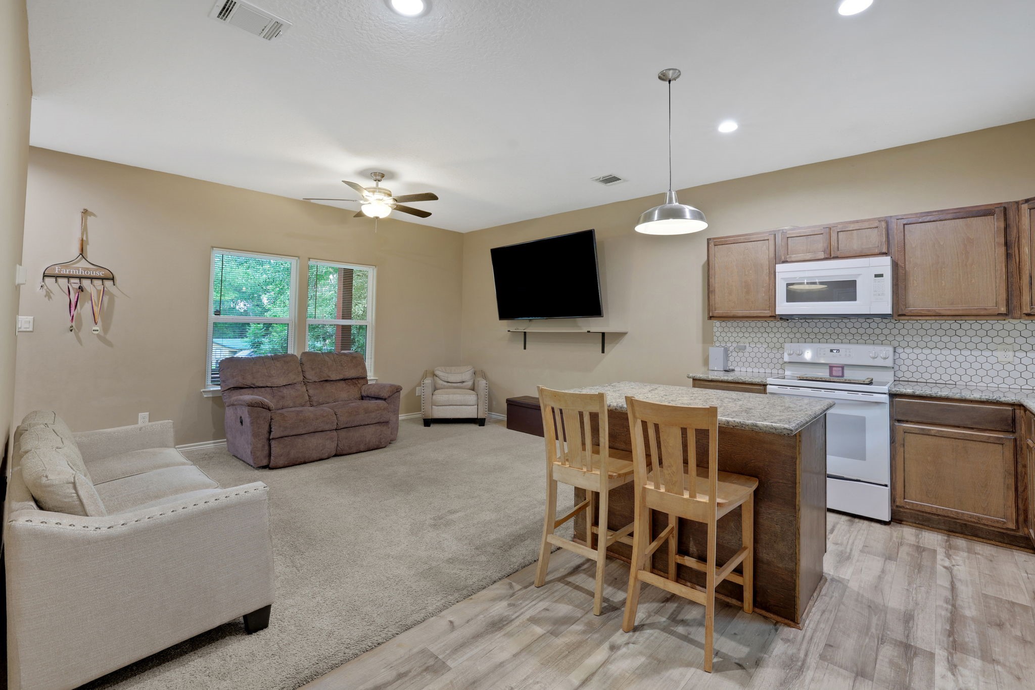 97 Harrell Road Coldspring, TX 77331 - Photo 11 of 31 Vinyl plank "wood look" flooring in the kitchen and bathrooms