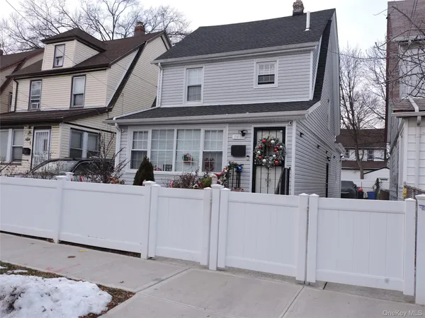 a view of a house with white walls