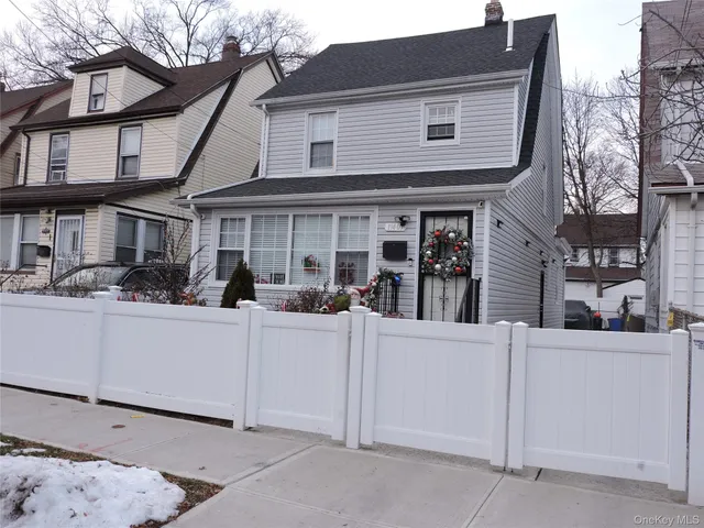 a view of a house with white walls
