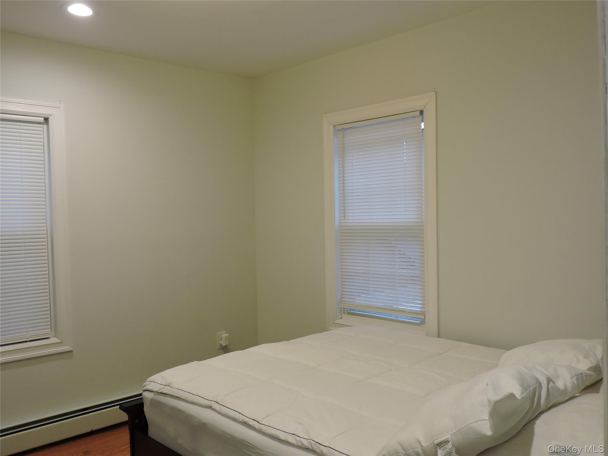 194-00 112th Road Queens, NY 11412 - Photo 14 of 17 a bedroom with a bed and cabinets