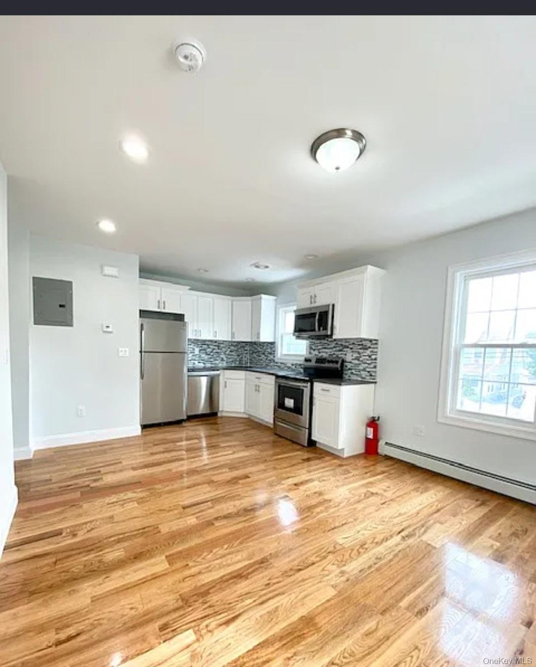 194-00 112th Road Queens, NY 11412 - Photo 2 of 17 a view of a kitchen with a sink and cabinets