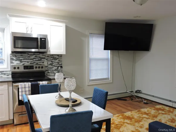 a living room with fireplace furniture and a flat screen tv