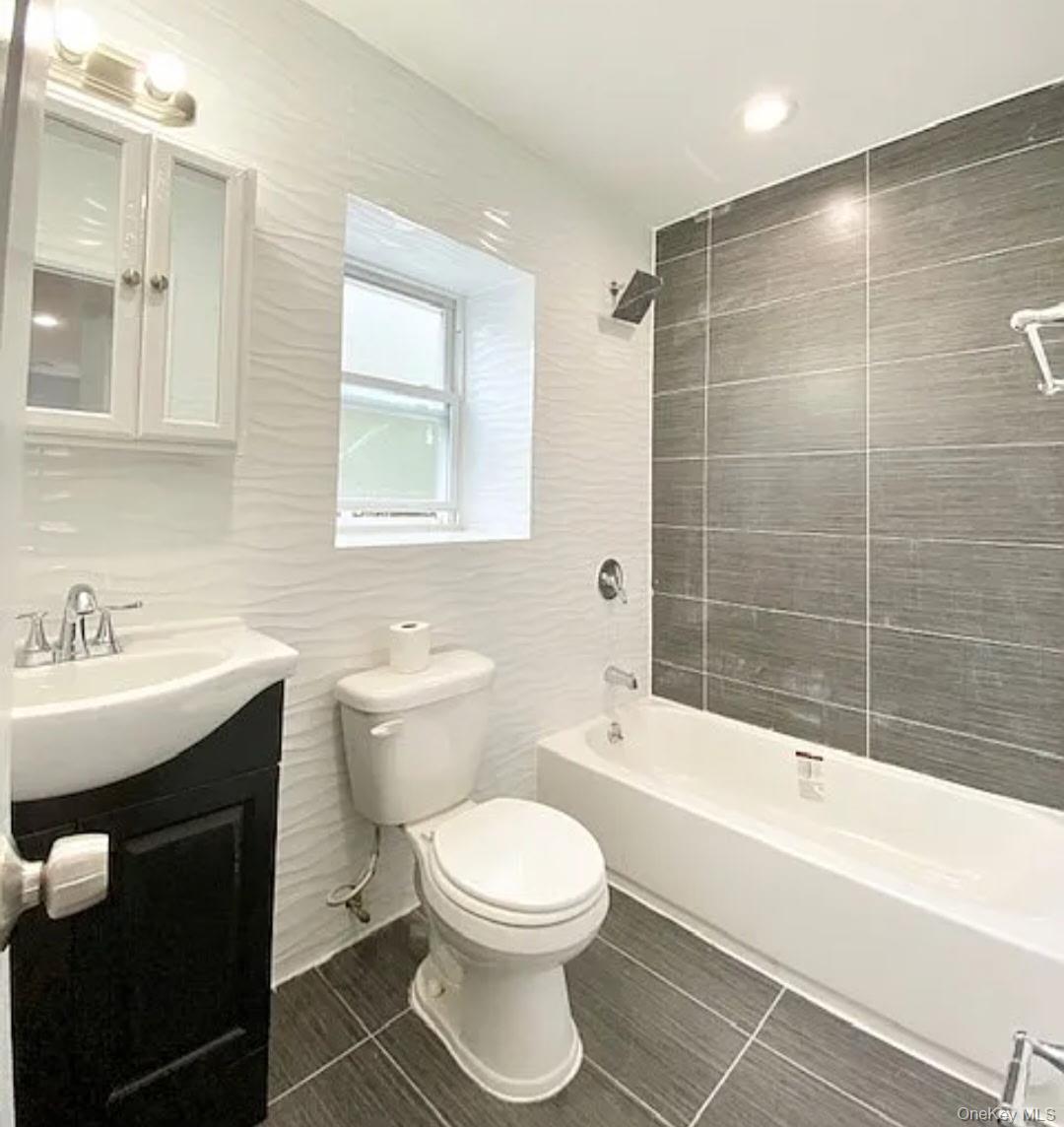 194-00 112th Road Queens, NY 11412 - Photo 9 of 17 a bathroom with a sink toilet a mirror and shower