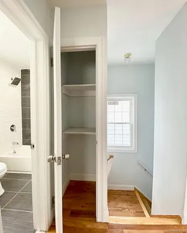 a view of an empty room with a window