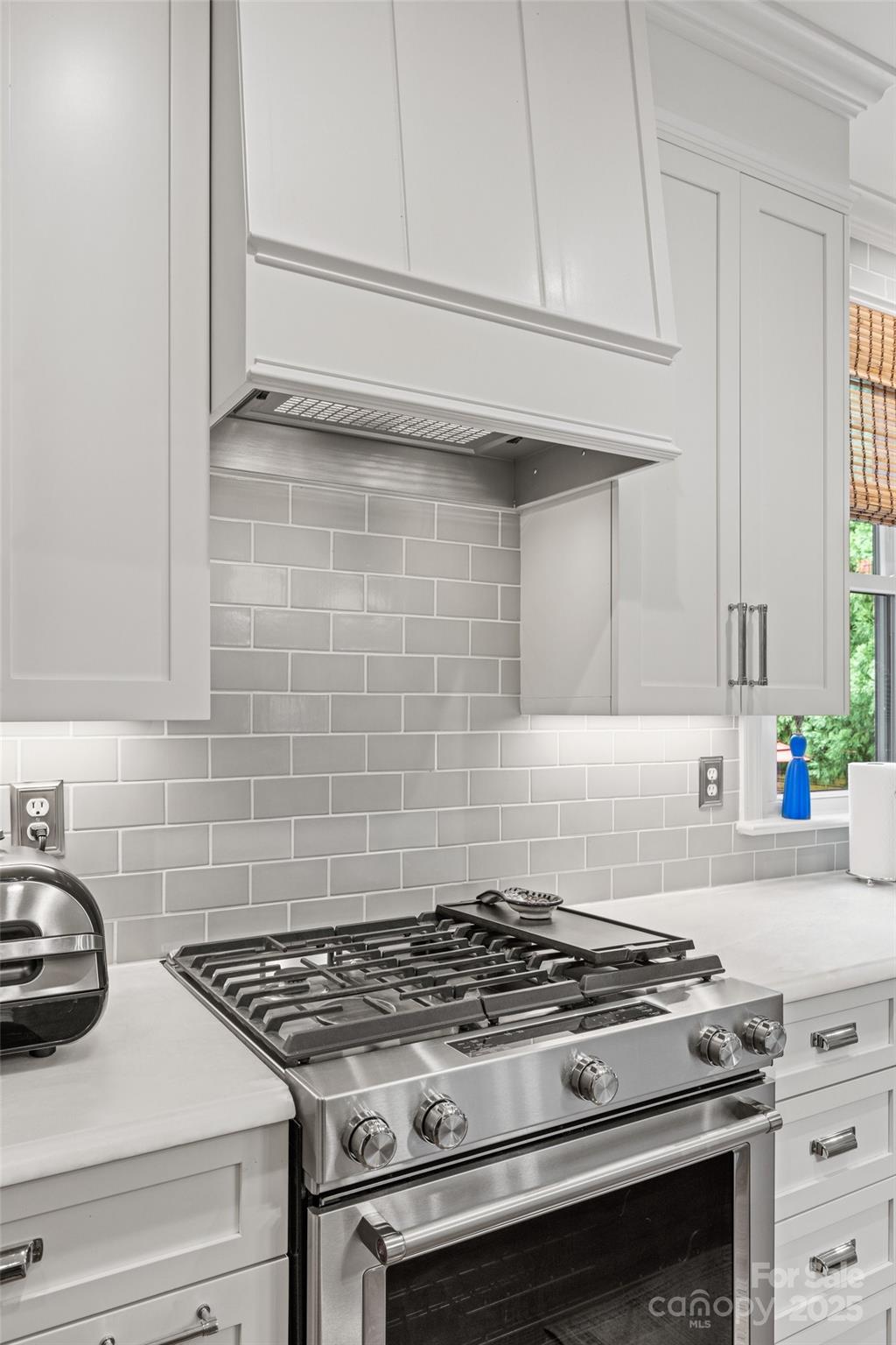 2329 Club Road Charlotte, NC 28205 - Photo 18 of 48 a stove top oven sitting inside of a kitchen