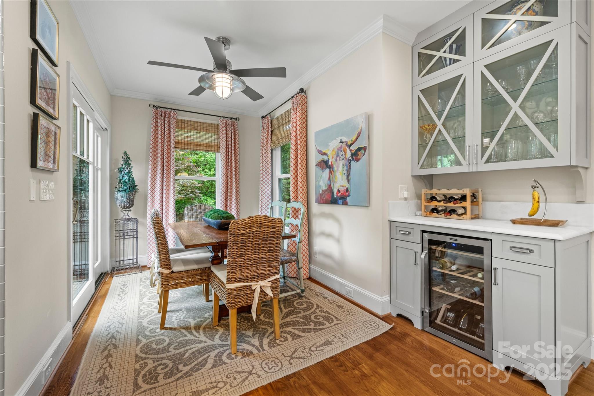2329 Club Road Charlotte, NC 28205 - Photo 20 of 48 a dining room with wooden floor and a window