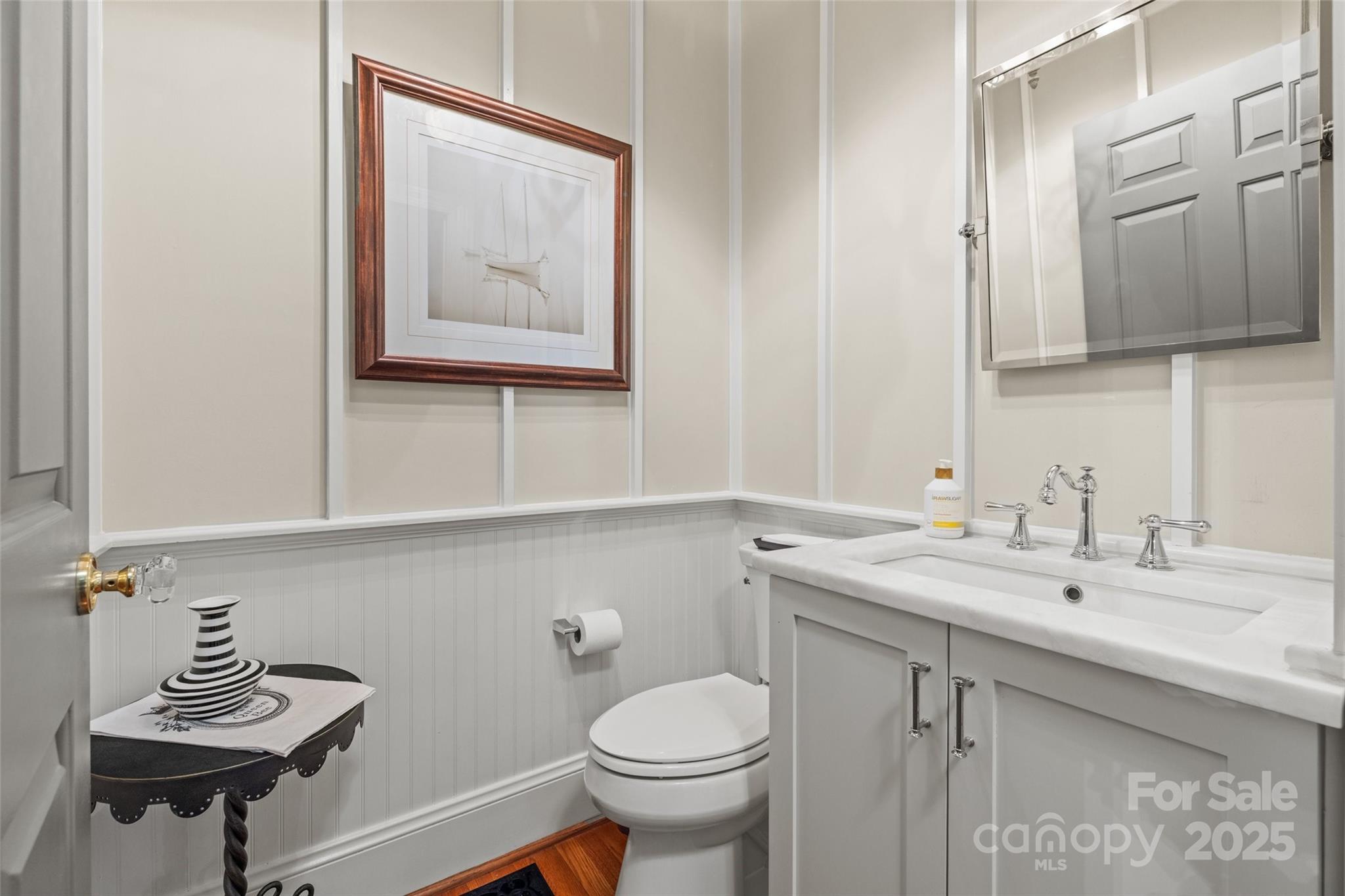 2329 Club Road Charlotte, NC 28205 - Photo 22 of 48 a bathroom with a toilet a sink and mirror