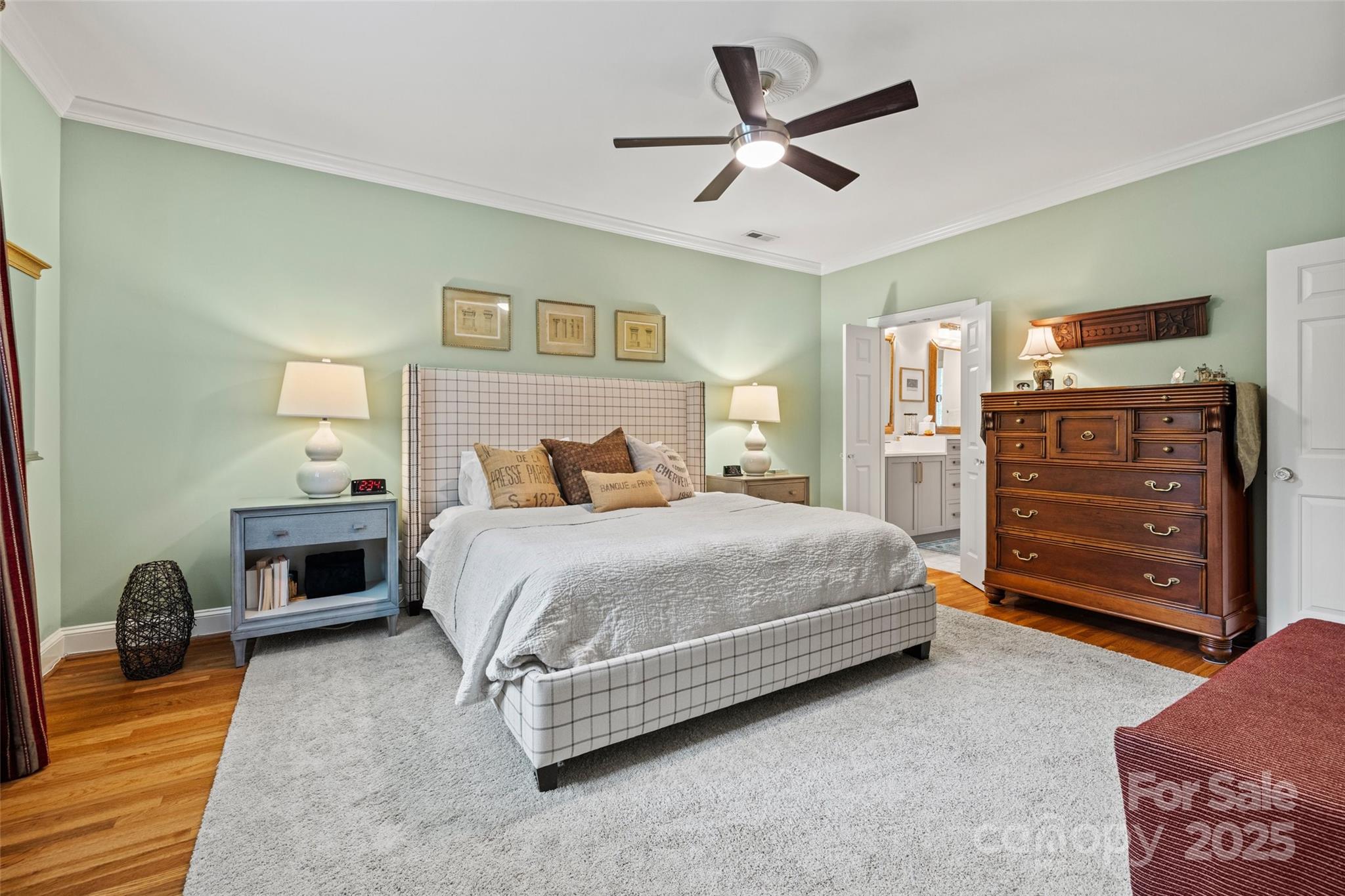 2329 Club Road Charlotte, NC 28205 - Photo 25 of 48 a bedroom with a bed and a chandelier