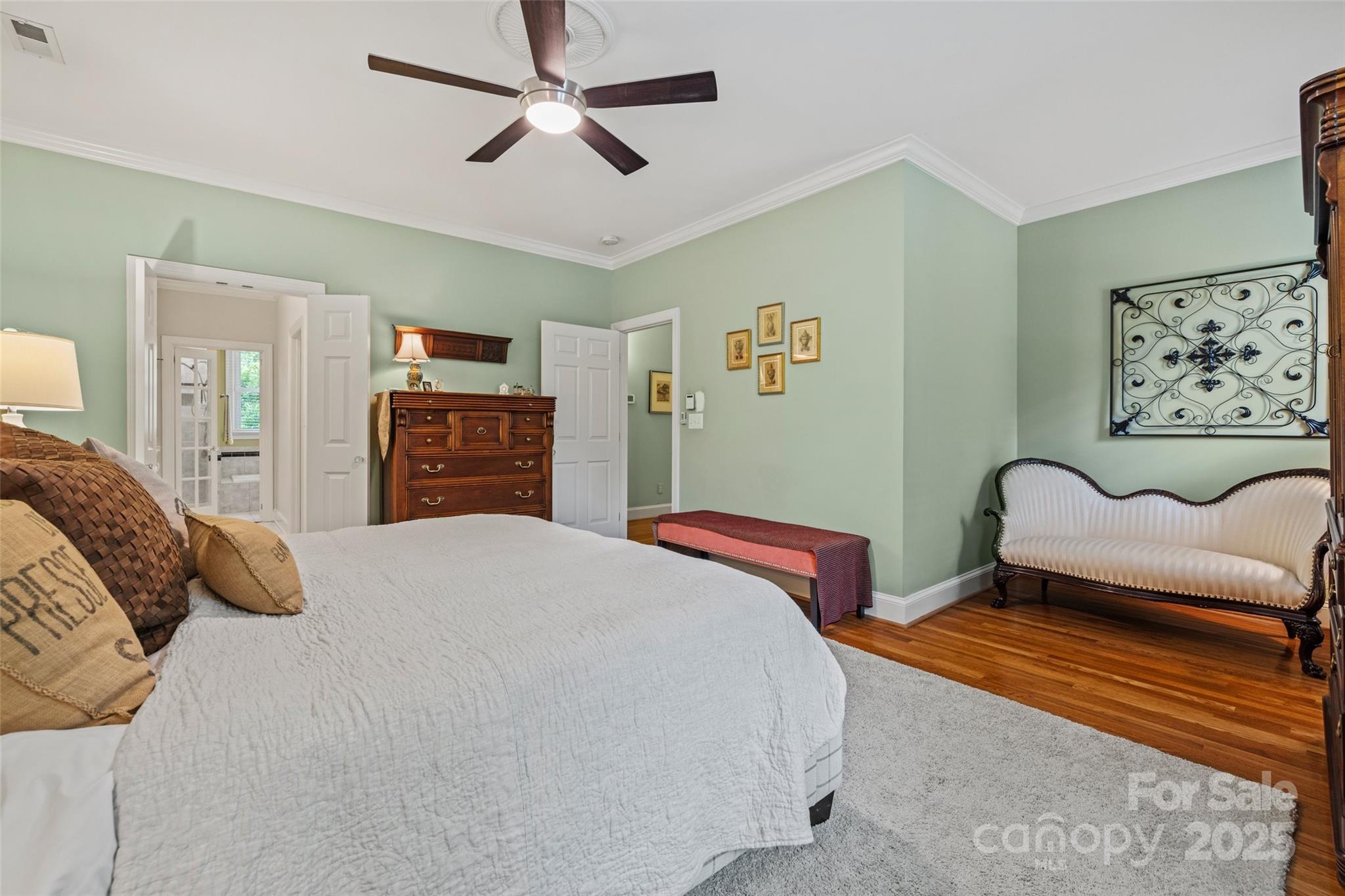 2329 Club Road Charlotte, NC 28205 - Photo 26 of 48 a bedroom with a bed and wooden floor
