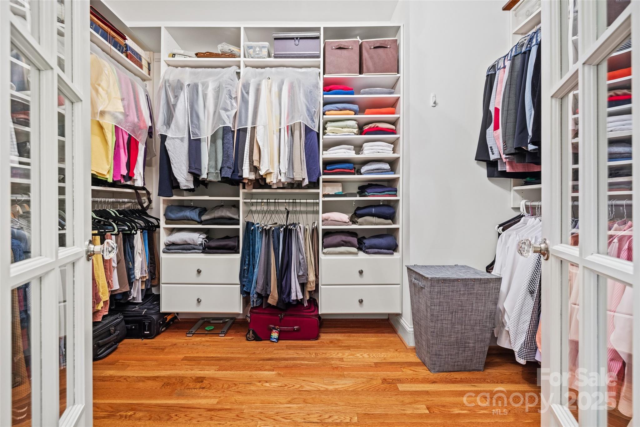2329 Club Road Charlotte, NC 28205 - Photo 31 of 48 a view of walk in closet with clothes and shoes