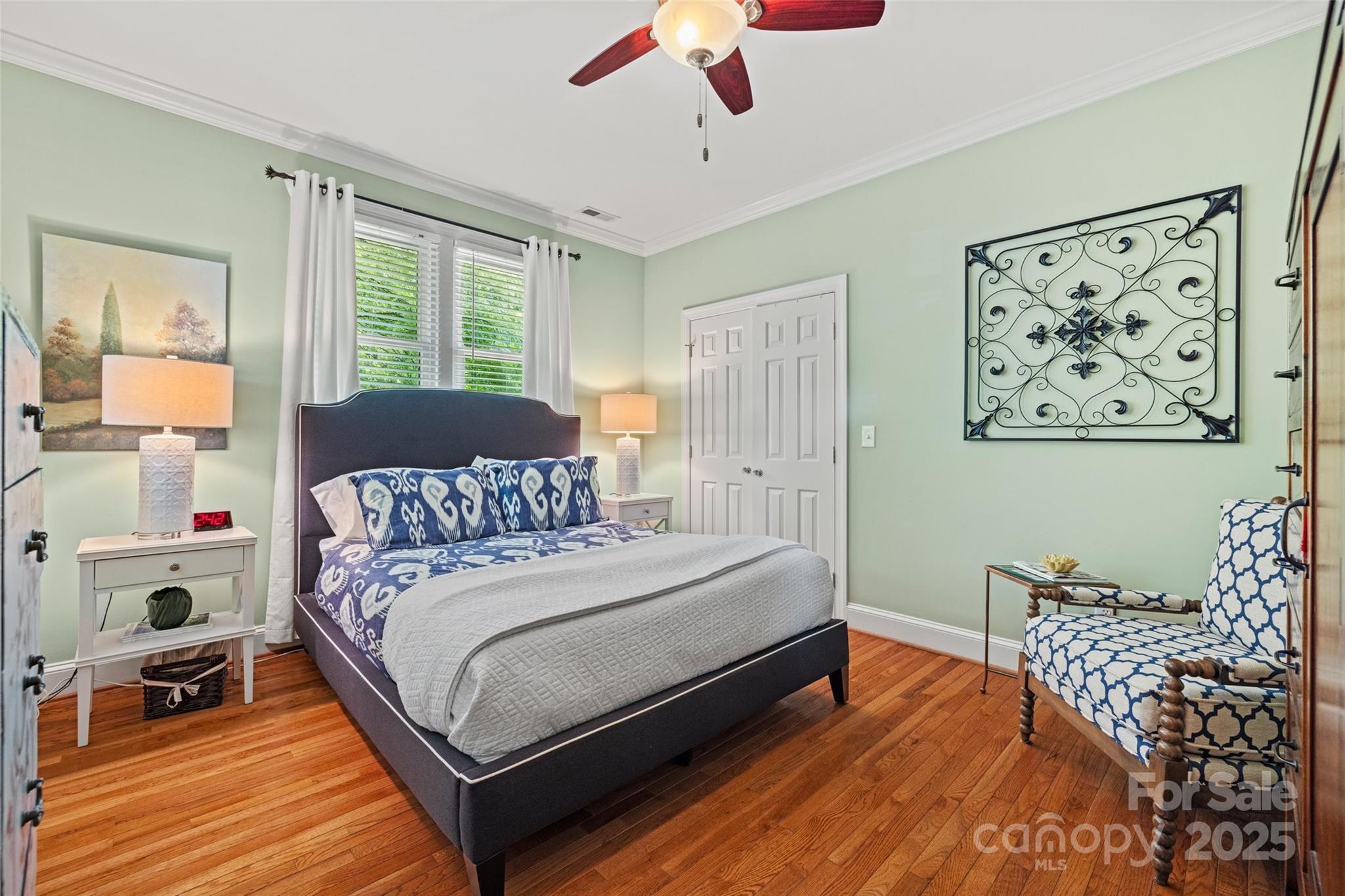 2329 Club Road Charlotte, NC 28205 - Photo 32 of 48 a bedroom with a bed wooden floor and window