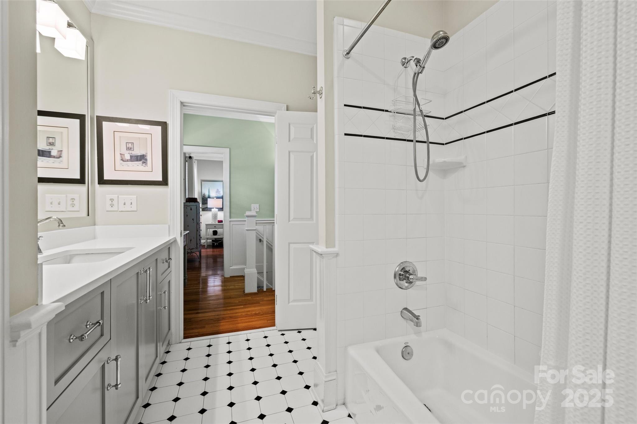 2329 Club Road Charlotte, NC 28205 - Photo 35 of 48 a bathroom with a bathtub a sink a vanity and a shower