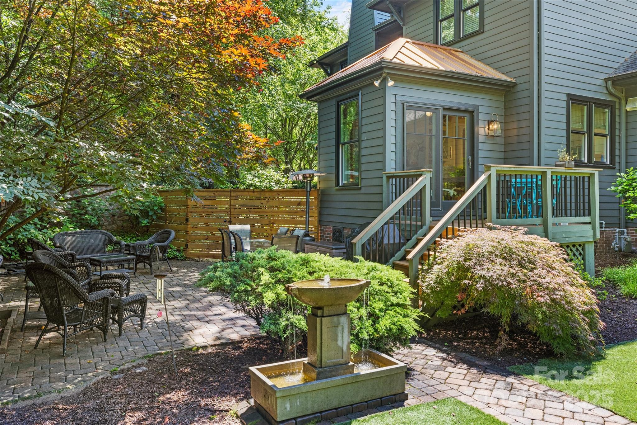 2329 Club Road Charlotte, NC 28205 - Photo 40 of 48 a view of a chair and table in backyard of the house