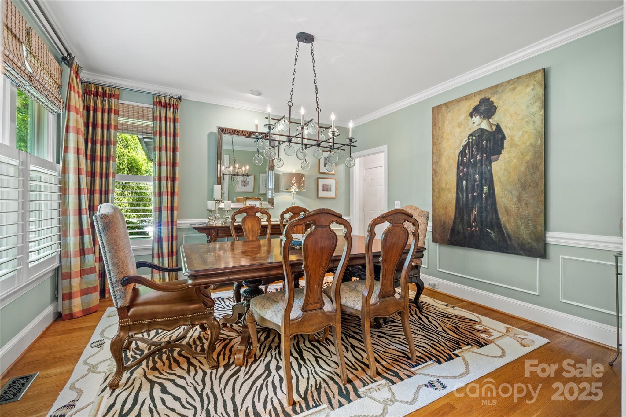 2329 Club Road Charlotte, NC 28205 - Photo 4 of 48 a view of a dining room with furniture wooden floor and chandelier