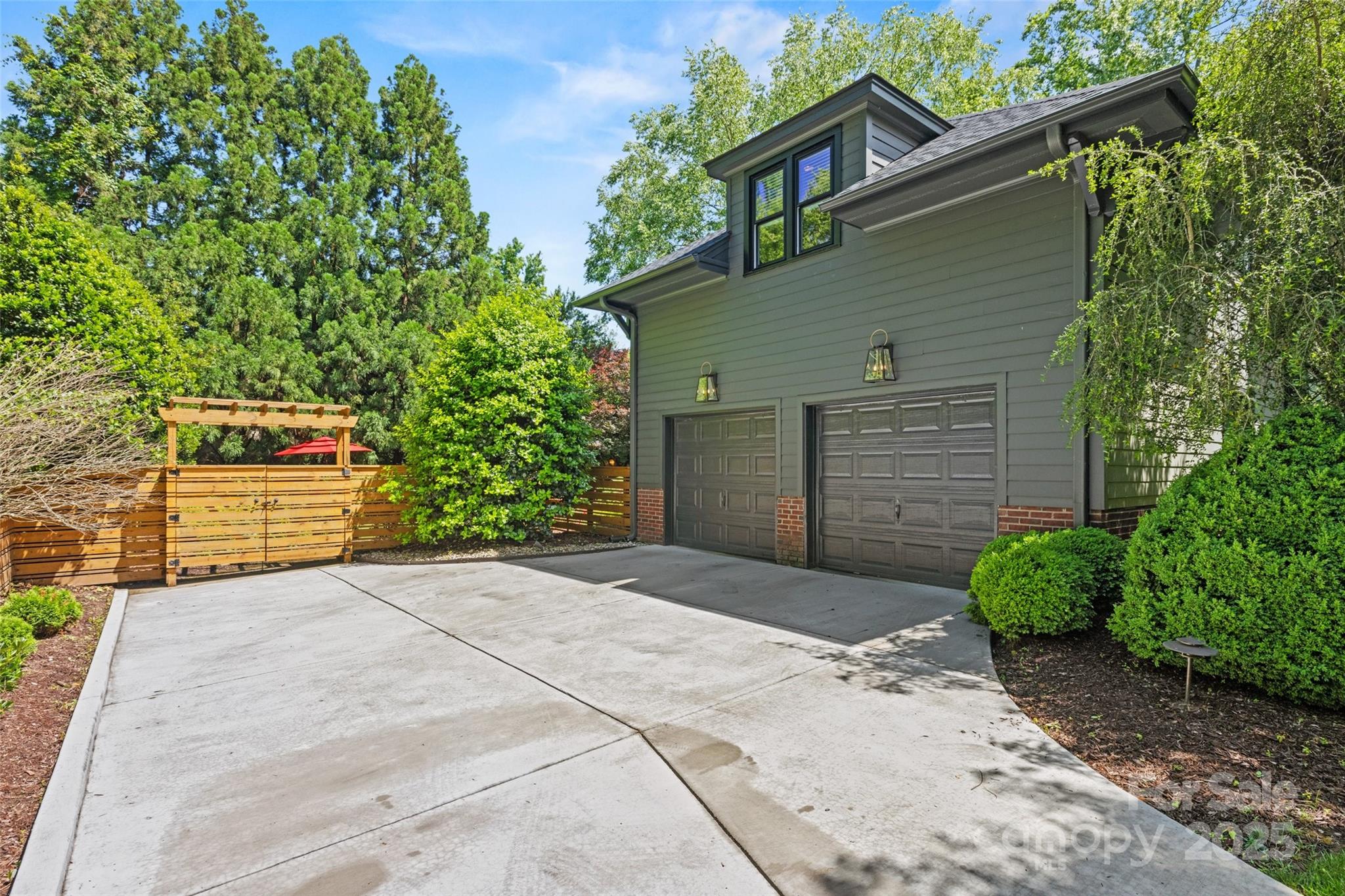 2329 Club Road Charlotte, NC 28205 - Photo 47 of 48 a front view of a house with a yard and garage