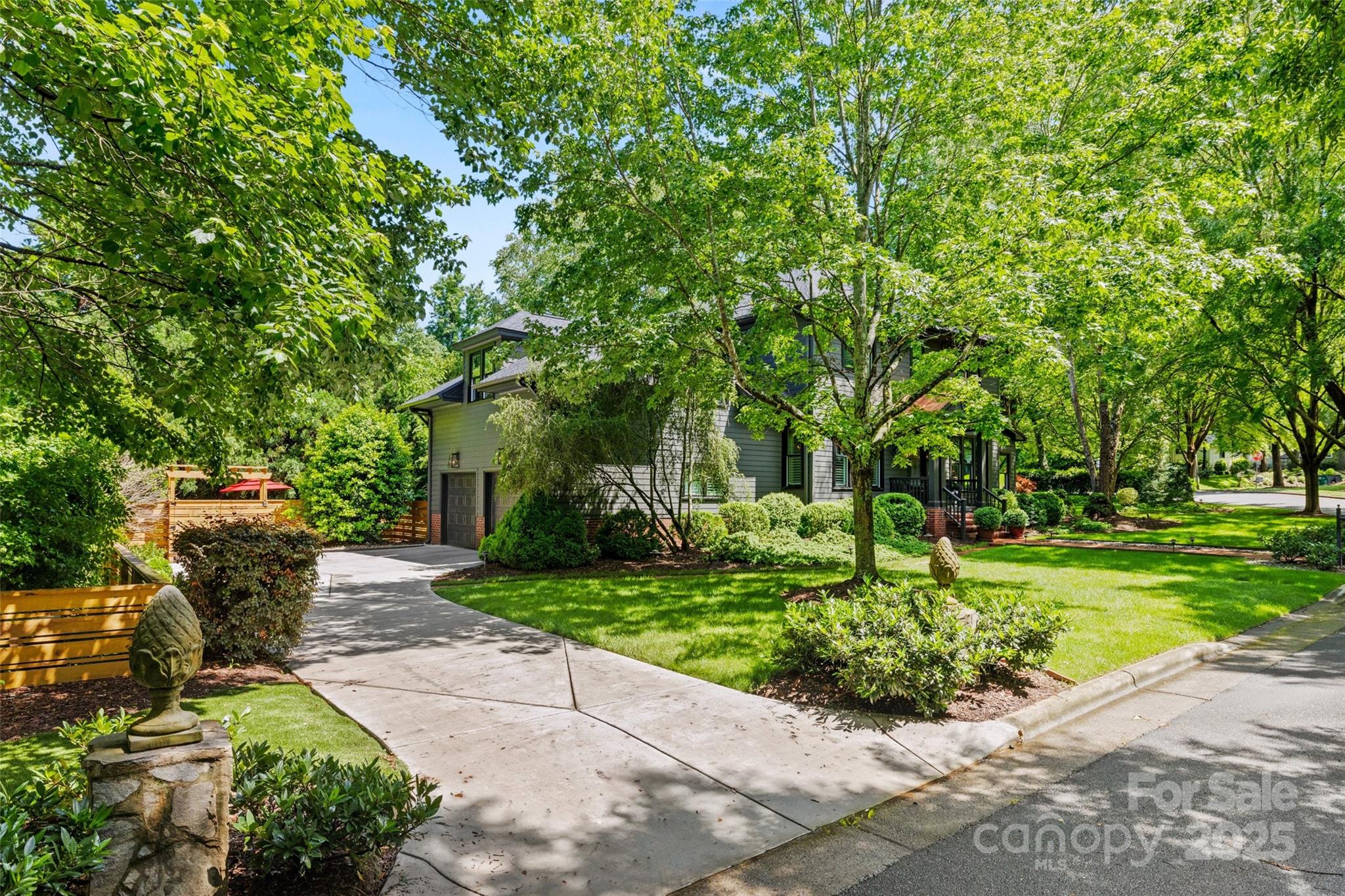 2329 Club Road Charlotte, NC 28205 - Photo 48 of 48 a garden with trees in front of it