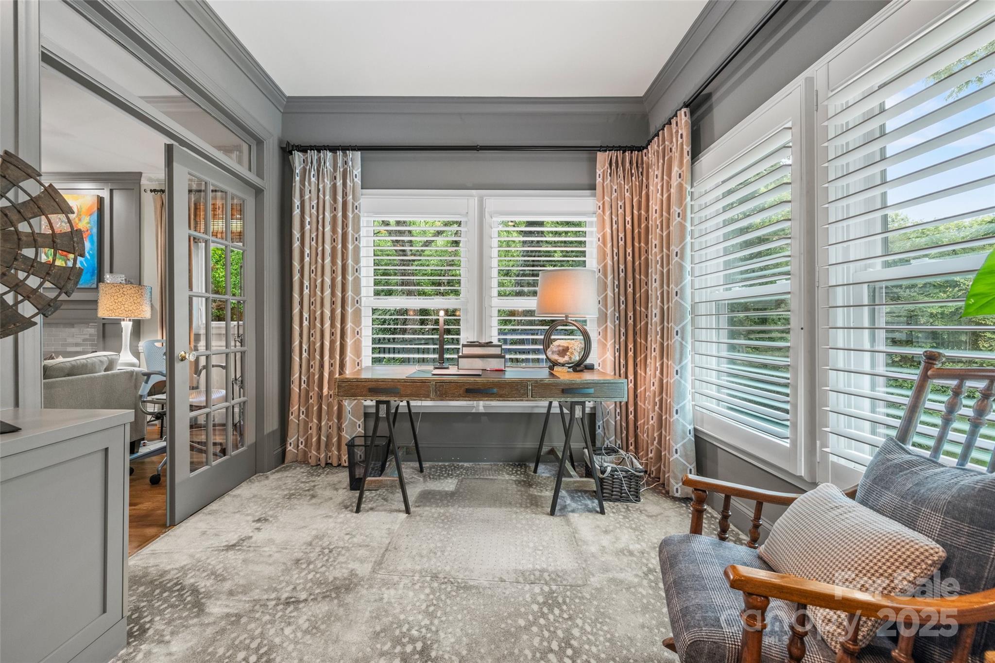 2329 Club Road Charlotte, NC 28205 - Photo 10 of 48 a view of a workspace with furniture and a window