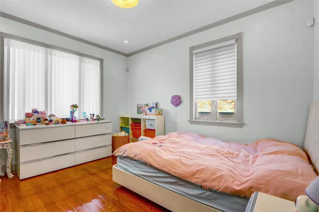 a bedroom with bed and window