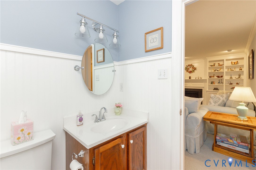 5724 Grove Forest Road Midlothian, VA 23112 - Photo 12 of 47 Vanity with wood-finish cabinetry, integrated sink
