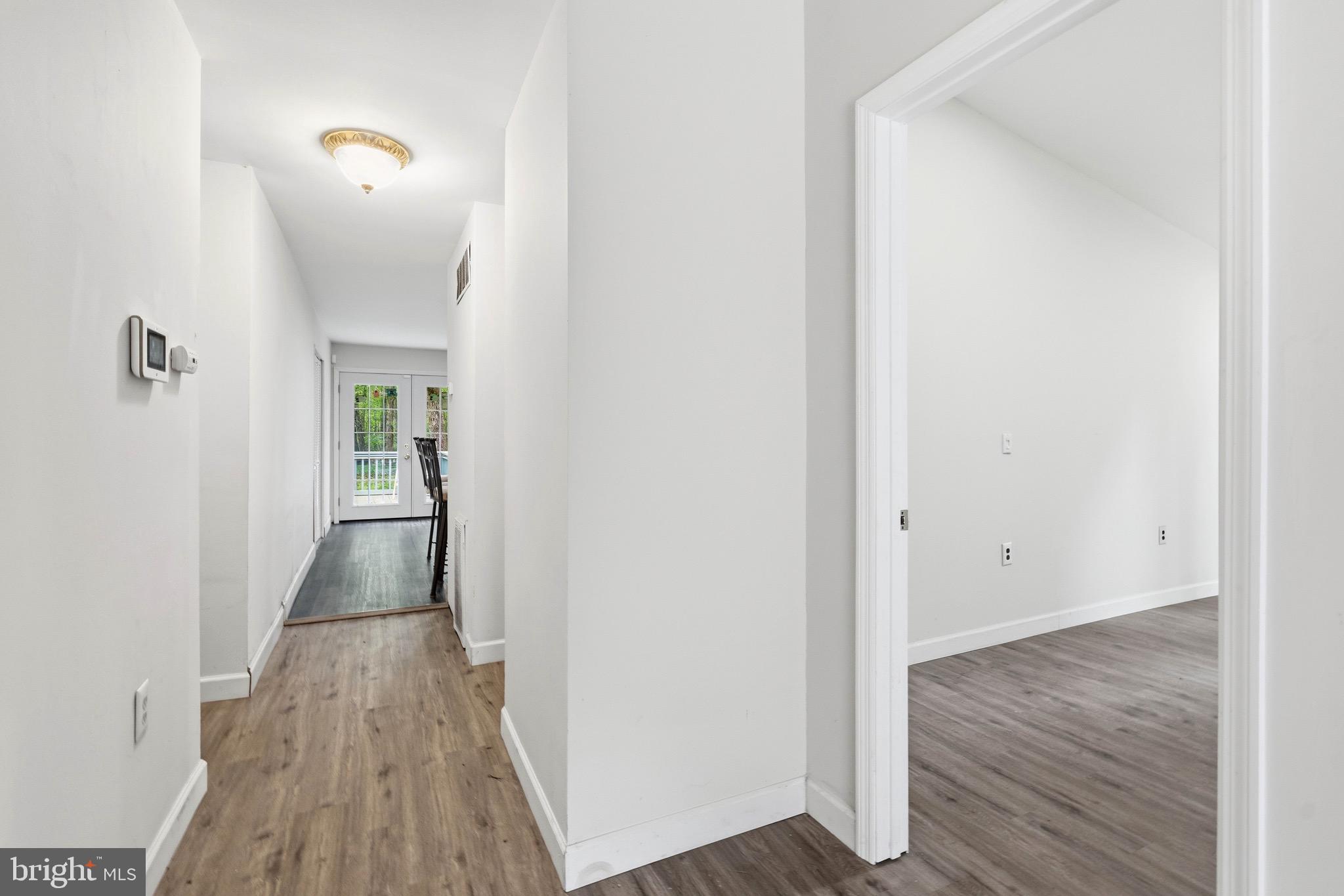 188 Carlisle Place Road Leesburg, NJ 08327 - Photo 8 of 36 a view of a hallway with wooden floor