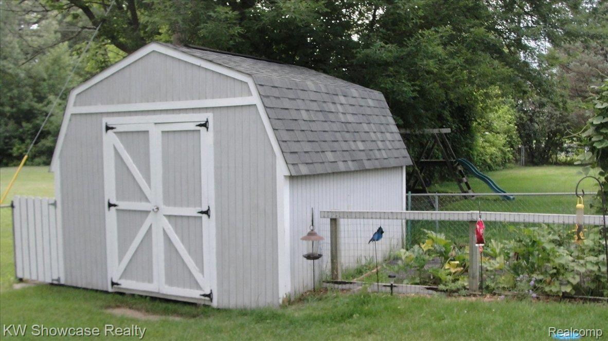 7599 Highland Road White Lake, MI 48383 - Photo 18 of 20 Large 12x12 Shed in Back Yard