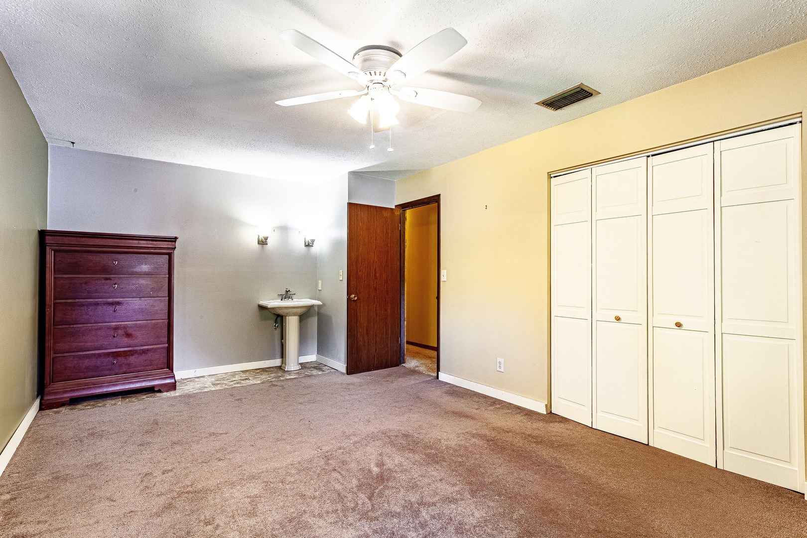 16176 Strawberry Road Morrison, IL 61270 - Photo 14 of 42 a view of an empty room with a ceiling fan