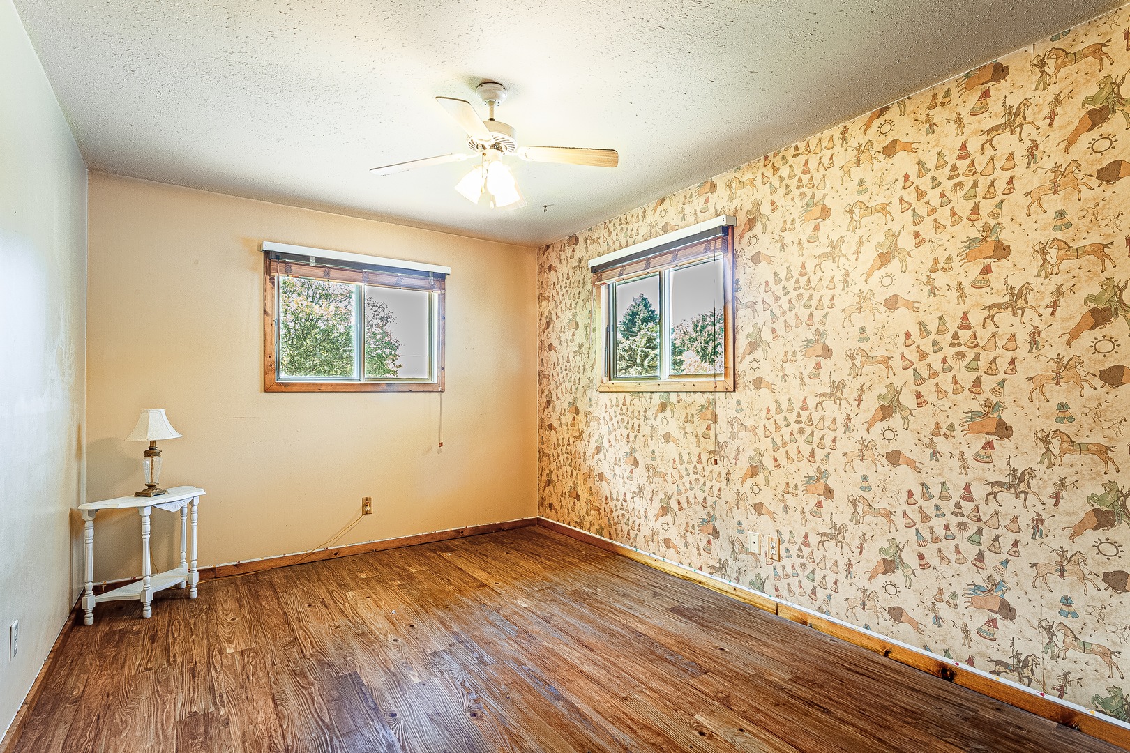 16176 Strawberry Road Morrison, IL 61270 - Photo 16 of 42 a view of empty room with wooden floor and fan
