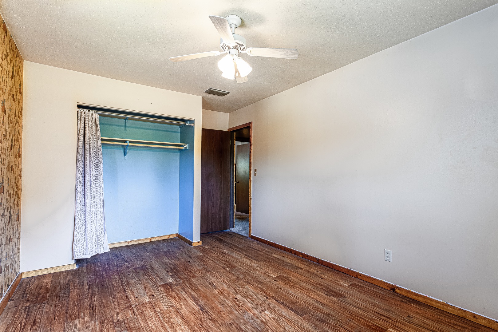 16176 Strawberry Road Morrison, IL 61270 - Photo 17 of 42 a view of a room with wooden floor and chandelier fan