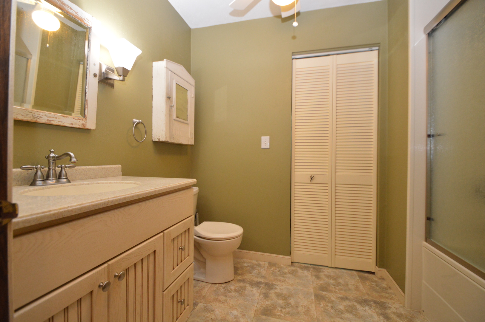 16176 Strawberry Road Morrison, IL 61270 - Photo 21 of 42 a bathroom with a sink a toilet and shower