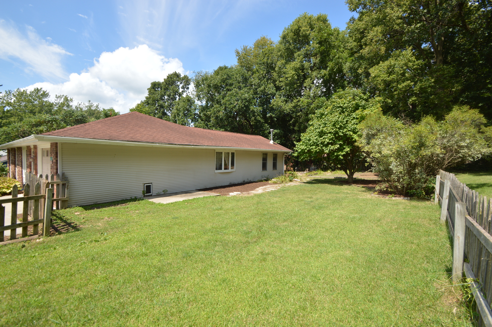 16176 Strawberry Road Morrison, IL 61270 - Photo 22 of 42 a front view of a house with a yard and garage