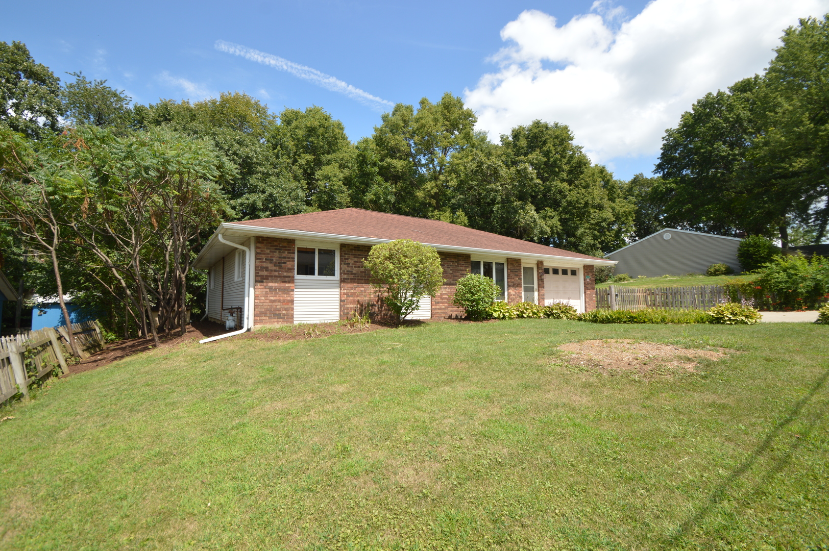 16176 Strawberry Road Morrison, IL 61270 - Photo 23 of 42 a front view of a house with a garden