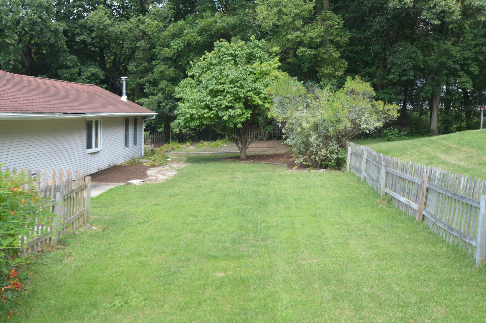 16176 Strawberry Road Morrison, IL 61270 - Photo 25 of 42 a front view of a house with garden