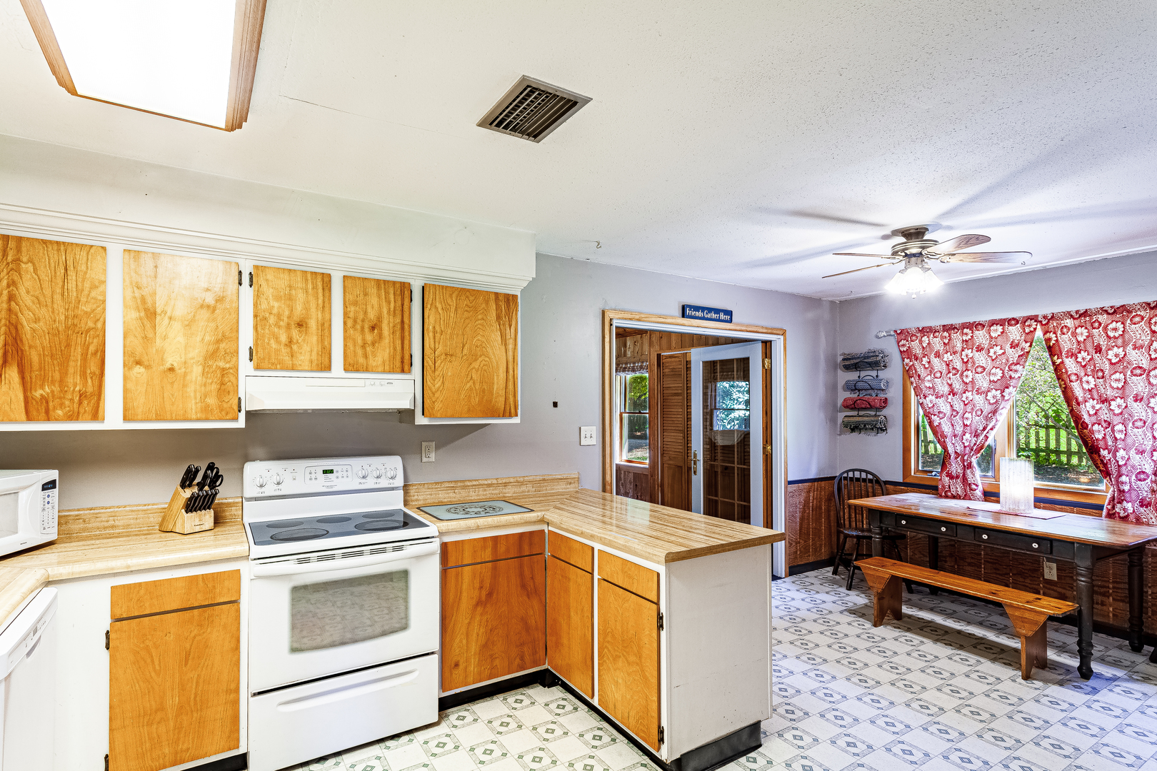 16176 Strawberry Road Morrison, IL 61270 - Photo 6 of 42 a kitchen with a stove a sink and a refrigerator