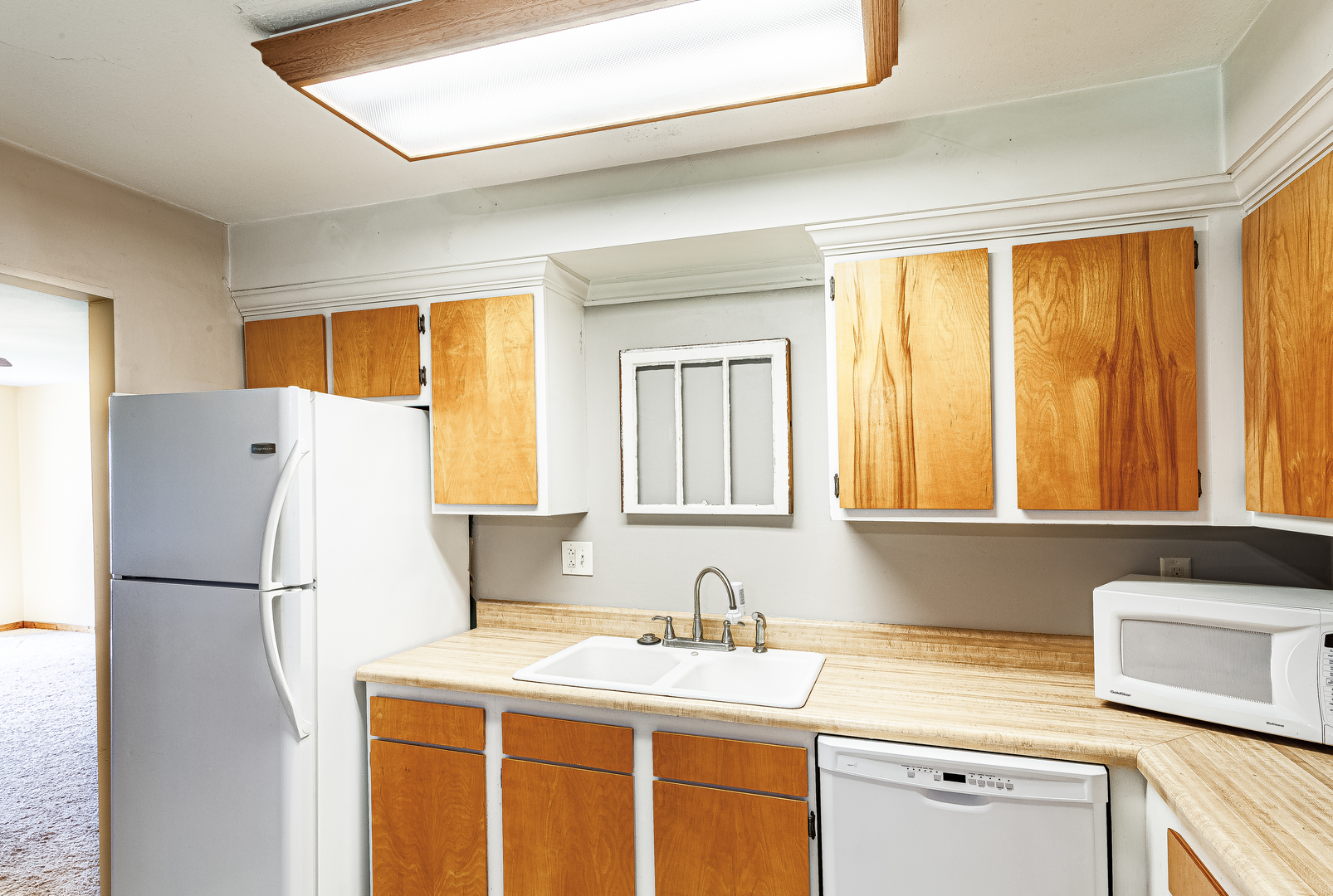 16176 Strawberry Road Morrison, IL 61270 - Photo 7 of 42 a kitchen with a refrigerator a sink and a cabinets